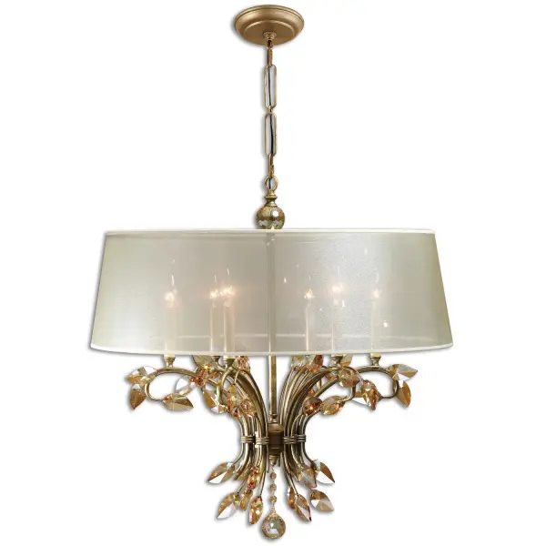 The Alenya blends burnished gold metal, golden teak crystal leaf accents, and a silken sheer shade for a soft, glamorous glow — a striking focal point for dining rooms and foyers.