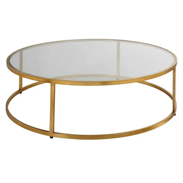 A Complement To Any Modern Space, The Radius Coffee Table Features An Iron Frame Finished In Lightly Antiqued Gold With A Clear Glass Top. Collection: Radius Finish: Antiqued Gold Width: 48.00" Height: 14.50" Length: 48.00" Weight: 80.00 lb Material: Iron, Glass Country of Origin: China Safety Rating: Indoor Only
