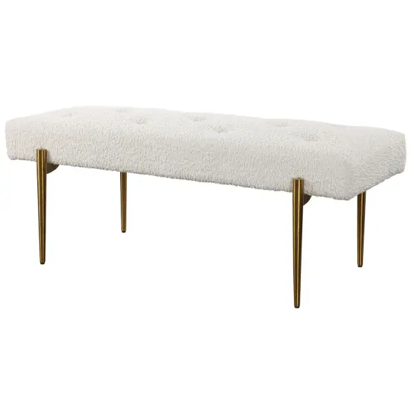 Expertly Tailored In White Faux Shearling, This Glamorous Accent Bench Features A Plush Button Tufted Seat, Atop Four Tapered Stainless Steel Legs Finished In Antique Brushed Brass. Collection: Olivier Designer: Jim Parsons Finish: White Width: 49.00" Height: 19.00" Length: 20.00" Weight: 26.50 lb Material: Stainless Steel, Fabric, Plywood, Foam Country of Origin: China Safety Rating: Indoor Only