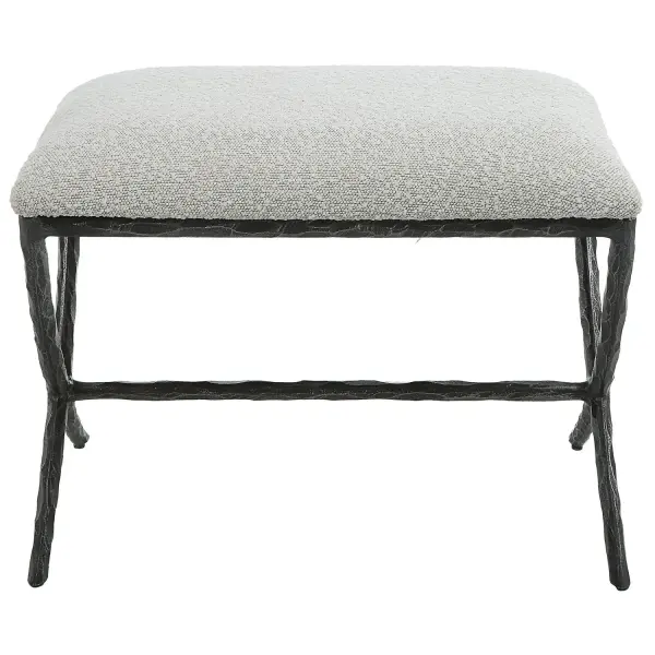 With Clean Contemporary Lines, This Cast Iron Base Features A Chiseled Texturing With A Distressed Charcoal Finish. Topped With An Upholstered Seat In A Casual Ivory And Light Gray Boucle Fabric. Collection: Brisby Designer: Matthew Williams Finish: Distressed Charcoal Width: 24.00" Height: 19.00" Length: 16.00" Weight: 30.94 lb Material: Cast Iron, Mdf, Foam, Fabric Country of Origin: Cambodia Safety Rating: Indoor Only