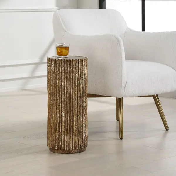 Waterfall Textures Make A Dramatic Statement In This Petite Drink Table. Finished In Heavily Textured Antique Gold With Black Glass Top. Collection: Echo Designer: Renee Wightman Finish: Antique Gold Width: 10.13" Height: 22.50" Length: 10.13" Weight: 18.00 lb Material: Resin, Glass Country of Origin: China Safety Rating: Indoor Only