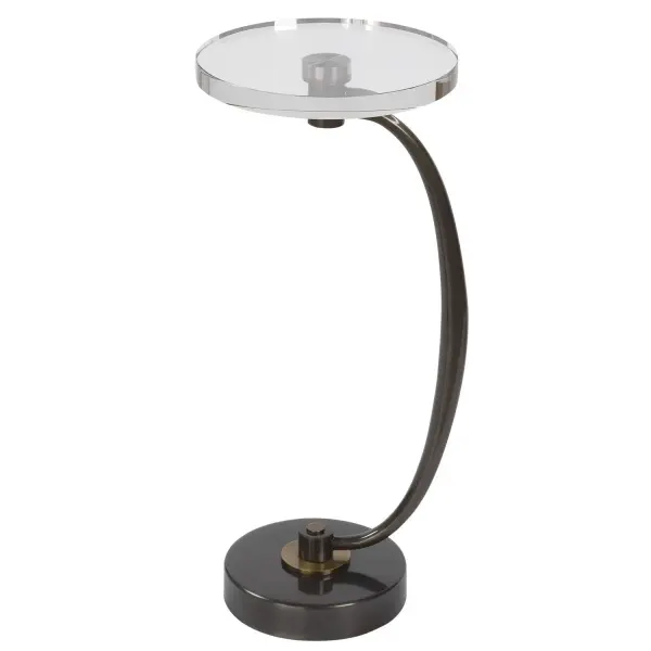 Minimal Yet Sophisticated, The Waveney Drink Table Displays A Sleek Curved Iron Base In Dark Bronze With Antique Brass Plated Accents And A Thick Crystal Top. Collection: Waveney Designer: David Frisch Finish: Dark Bronze Width: 11.50" Height: 24.00" Length: 11.50" Weight: 16.00 lb Material: Iron, Crystal Country of Origin: China Safety Rating: Indoor Only