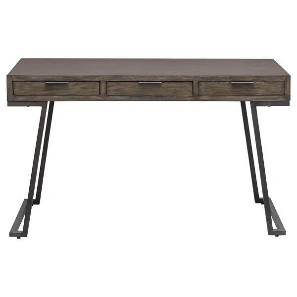 The Comrade Desk Provides A Perfect Spot For Ample Productivity. The Desk Is Finished In A Mango Wood Veneer With Light Gray Glazing And Natural Wood Undertones, Supported By A Metal Base In Aged Steel. Features Three Drawers With Coordinating Metal Tab Drawer Pulls. Collection: Comrade Designer: Osvaldo Mendoza Finish: Mango Wood Width: 50.00" Height: 29.50" Length: 20.00" Weight: 57.00 lb Material: Title Tsca Vi, Java Mix Wood, Veneer, Metal, Plywood Country of Origin: Indonesia Safety Rating: Indoor Only