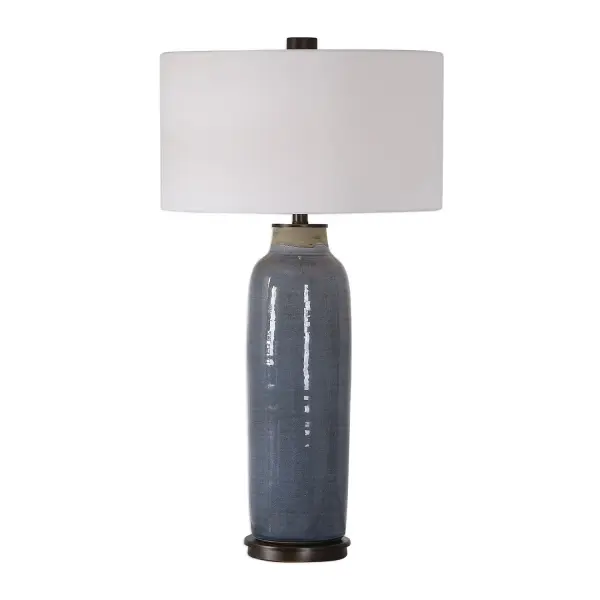 This Table Lamp Lends A Touch Of Old-world, Handcrafted Style With This Ceramic Base Finished In A Distressed Slate Blue Glaze Accented With Oil Rubbed Bronze Accents. The Round Hardback Drum Shade Is A White Linen Fabric. Due To The Nature Of Fired Glazes On Ceramic Lamps, Finishes Will Vary Slightly. Collection: Vicente Designer: David Frisch Finish: Oil Rubbed Bronze Glass: Round Hardback Drum Width: 18.00" Height: 33.50" Length: 18.00" Weight: 18.30 lb Number of Bulbs: 1 Maximum Wattage: 150.00 W Bulb Type: A Voltage: 110.00 V Material: Steel & Ceramic & Fabric Country of Origin: China Safety Rating: Indoor Only Switch: 3-WAY