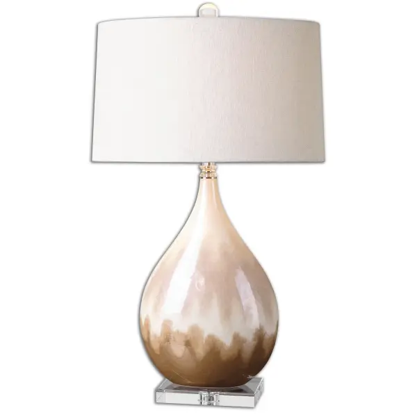 Ceramic Base Finished In A Metallic Rust Beige Glaze With Ivory Undertones, Paired With Crystal Accents And Polished Nickel Details. The Slightly Tapered Oval Hardback Shade Is A Light Beige Linen Fabric With Natural Slubbing. Due To The Nature Of Fired Glazes On Ceramic Lamps, Finishes Will Vary Slightly. Collection: Flavian Designer: Jim Parsons Finish: Rust Beige Glass: Slightly Tapered Oval Hardback Width: 18.00" Height: 30.25" Length: 18.00" Weight: 12.00 lb Number of Bulbs: 1 Maximum Wattage: 150.00 W Bulb Type: A Voltage: 110.00 V Material: Crystal / Ceramic Country of Origin: China Safety Rating: Indoor Only Switch: 3-WAY
