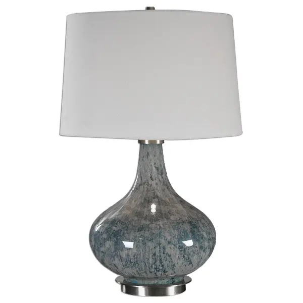 Mottled, Light Blue Gray Glass Accented With Plated Brushed Brass Details. The Slightly Tapered Round Hardback Shade Is An Ivory Linen Fabric With Light Slubbing. Collection: Celinda Designer: David Frisch Finish: Blue Gray, Brushed Brass Glass: Slightly Tapered Round Hardback Width: 15.50" Height: 24.75" Length: 14.00" Weight: 6.00 lb Number of Bulbs: 1 Maximum Wattage: 150.00 W Bulb Type: A Voltage: 110.00 V Material: Glass, Metal, Fabric Country of Origin: China Safety Rating: Indoor Only Switch: 3-WAY