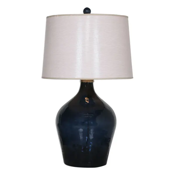 Lightly Hammered, Midnight Blue Glass Accented With Polished Nickel Plated Details. The Round, Tapered, Hardback Shade Is A Beige Linen Fabric With Light Slubbing. Collection: Lamone Finish: Polished Nickel Glass: Tapered Round Hardback Width: 18.00" Height: 31.00" Length: 18.00" Weight: 15.00 lb Number of Bulbs: 1 Maximum Wattage: 150.00 W Bulb Type: A Voltage: 110.00 V Material: Glass, Aluminum, Linen Country of Origin: India Safety Rating: Indoor Only Switch: 3-WAY