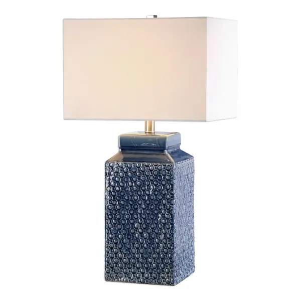 Textured Ceramic Finished In A Fired Sapphire Blue Glaze Accented With Brushed Nickel Plated Details. The Rectangle Hardback Shade Is A White Linen Fabric. Due To The Nature Of Fired Glazes On Ceramic Lamps, Finishes Will Vary Slightly. Collection: Pero Designer: Jim Parsons Finish: Brushed Nickel Glass: Rectangle Hardback Width: 15.00" Height: 26.75" Length: 11.00" Weight: 12.40 lb Number of Bulbs: 1 Maximum Wattage: 150.00 W Bulb Type: A Voltage: 110.00 V Material: Ceramic/Iron Country of Origin: China Safety Rating: Indoor Only Switch: 3-WAY