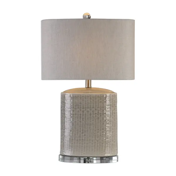 Textured, Oval Ceramic Base Finished In A Light Taupe-gray Glaze, With Brushed Nickel Plated Accents And Crystal Details. The Oval Hardback Drum Shade Is A Beige Linen Fabric With Natural Slubbing. Due To The Nature Of Fired Glazes On Ceramic Lamps, Finishes Will Vary Slightly. Collection: Modica Designer: Jim Parsons Finish: Brushed Nickel Glass: Oval Hardback Drum Width: 16.00" Height: 25.50" Length: 9.00" Weight: 11.30 lb Number of Bulbs: 1 Maximum Wattage: 100.00 W Bulb Type: A Voltage: 110.00 V Material: High Temperature Ceramic/Crystal Country of Origin: China Safety Rating: Indoor Only Switch: ON-OFF