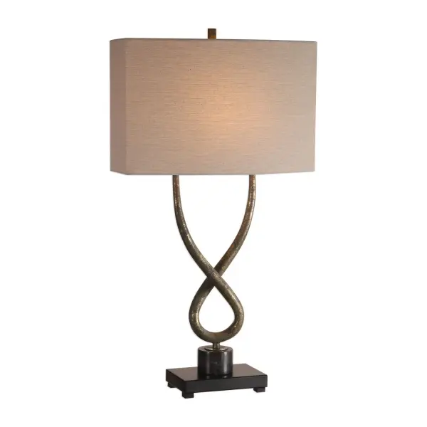 This Twisted Steel Base Is Gracefully Curved With A Subtly Tapering Design, Finished In A Heavily Distressed Aged Silver Leaf With Charcoal Undertones, Displayed On A Black Marble Column. The Oval Hardback Shade Is A Light Beige Linen Fabric With Straight Sides. Collection: Talema Designer: Jim Parsons Finish: Aged Silver Leaf Glass: Oval Hardback With Straight Sides Width: 17.00" Height: 30.25" Length: 9.00" Weight: 7.50 lb Number of Bulbs: 1 Maximum Wattage: 100.00 W Bulb Type: A Voltage: 110.00 V Material: Steel & Marble Country of Origin: China Safety Rating: Indoor Only Switch: ON-OFF