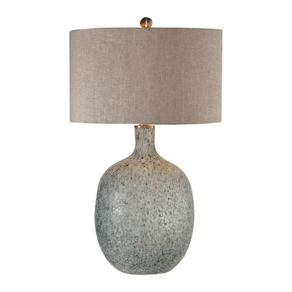 The Finish On This Glass Base Is Reminiscent To An Ocean Wave Crashing, Featuring Mottled Highlights Of Blue-green, Covered In A Heavily Textured Aged White Glaze, Paired With Brushed Nickel Plated Details. The Round Hardback Drum Shade Is A Light Beige Linen Fabric With Natural Slubbing. Collection: Oceaonna Designer: Carolyn Kinder Finish: Brushed Nickel Glass: Round Hardback Drum Width: 18.00" Height: 30.00" Length: 18.00" Weight: 13.00 lb Number of Bulbs: 1 Maximum Wattage: 150.00 W Bulb Type: A Voltage: 110.00 V Material: Glass, Fabric, Iron Country of Origin: China Safety Rating: Indoor Only Switch: 3-WAY