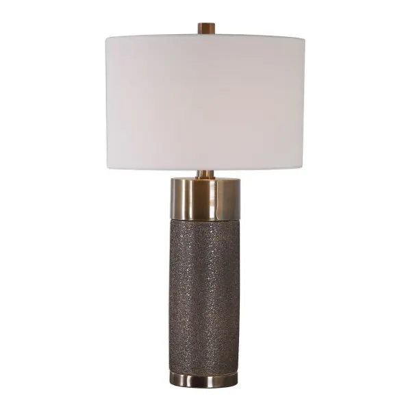 This Contemporary Table Lamp Design Showcases A Heavily Textured Ceramic Base That Is Finished In A Metallic Golden Bronze, Paired With Antique Brass Plated Iron Details. A Hardback Drum Shade In An Off-white Linen Fabric Completes This Piece. Collection: Brannock Designer: Matthew Williams Finish: Antique Brass Glass: Round Hardback Drum Width: 17.00" Height: 31.50" Length: 17.00" Weight: 10.20 lb Number of Bulbs: 1 Maximum Wattage: 150.00 W Bulb Type: A Voltage: 110.00 V Material: Iron, Ceramic, Fabric Country of Origin: China Safety Rating: Indoor Only Switch: 3-WAY