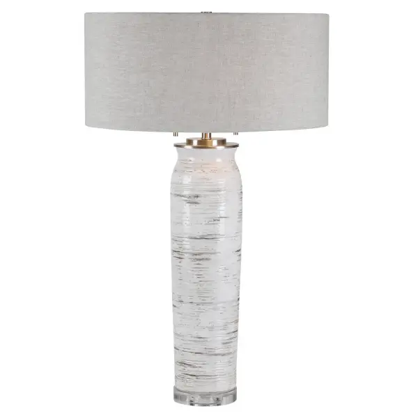 Inspired By The Bark Of A Birch Tree, This Table Lamp Features A Ceramic Base Finished In Off-white With Rust-colored Accents And Noticeable Texture And Distressing. The Piece Also Has A Crystal Foot And Brushed Nickel Details. The Round Hardback Shade Is A Light Oatmeal Linen Fabric With Slubbing. Collection: Lenta Designer: Jim Parsons Finish: Brushed Nickel Glass: Round Hardback Drum Width: 19.00" Height: 30.25" Length: 19.00" Weight: 9.90 lb Number of Bulbs: 2 Maximum Wattage: 60.00 W Bulb Type: A Voltage: 110.00 V Material: Ceramic, Iron, Crystal Country of Origin: China Safety Rating: Indoor Only Switch: ON-OFF