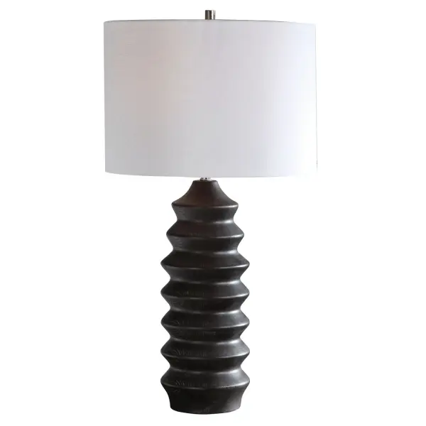 Showcasing A Modern Lodge Style, This Table Lamp Features A Carved Wood Base Finished In A Rustic Black Stain Exposing Subtle Wood Grain, Accented With Brushed Nickel Plated Details. The Lamp Is Paired With A Round Hardback Drum Shade In A White Linen Fabric. Collection: Mendocino Designer: Renee Wightman Finish: Rustic Black Glass: Round Drum Hardback Width: 16.00" Height: 30.00" Length: 16.00" Weight: 8.82 lb Number of Bulbs: 1 Maximum Wattage: 150.00 W Bulb Type: A Voltage: 110.00 V Material: Wood, Steel , Fabric Country of Origin: China Safety Rating: Indoor Only Switch: 3-WAY