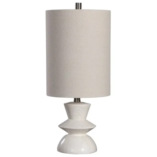A Nod To Classic Mid-century Styling, This Buffet Lamp Has A Geometric Shaped Base With A Bleached Wood Tone Look, Accented By Brushed Nickel Plated Details. A Light Beige Fabric Shade Accents The Piece. Collection: Stevens Designer: Osvaldo Mendoza Finish: Brushed Nickel Glass: Round Drum Hardback Width: 10.00" Height: 23.50" Length: 10.00" Weight: 5.00 lb Number of Bulbs: 1 Maximum Wattage: 150.00 W Bulb Type: A Voltage: 110.00 V Material: Poly, Steel Country of Origin: Cambodia Safety Rating: Indoor Only