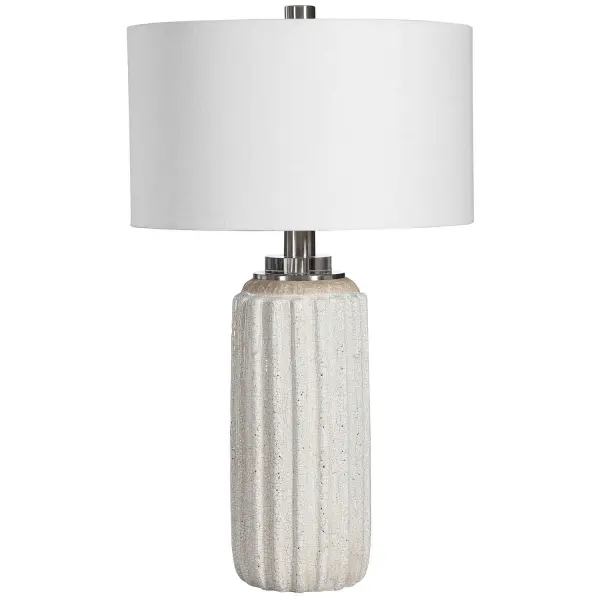 A Nod To Old-world Style, This Ceramic Table Lamp Features A Distressed Cream And Beige Crackle Glaze With A Deep Ribbed Texture, Accented By Brushed Nickel And Crystal Details. A White Linen Fabric Drum Shade Completes The Look. Collection: Azariah Designer: Carolyn Kinder Finish: Brushed Nickel Glass: Round Hardback Drum Width: 17.00" Height: 29.00" Length: 17.00" Weight: 12.00 lb Number of Bulbs: 1 Maximum Wattage: 150.00 W Bulb Type: A Voltage: 110.00 V Material: Iron, Ceramic, Crystal, Fabric Country of Origin: China Safety Rating: Indoor Only