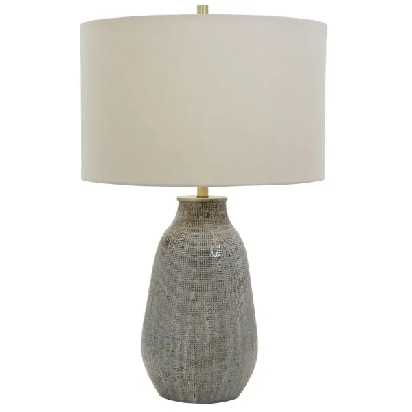 Exhibiting A Handcrafted Look, This Ceramic Table Lamp Features A Textured Finish Reminiscent Of Woven Fabric And Is Finished In Various Shades Of Neutral Grays And Taupe With Rust Brown Accents And Antique Brushed Brass Hardware. The Piece Is Completed By A Casual Khaki Hardback Drum Shade With Natural Slubbing. Collection: Monacan Designer: Osvaldo Mendoza Finish: Antique Brushed Brass Glass: Round Hardback Drum Width: 16.00" Height: 25.50" Length: 16.00" Weight: 10.00 lb Number of Bulbs: 1 Maximum Wattage: 150.00 W Bulb Type: A Voltage: 110.00 V Material: Steel, Ceramic Country of Origin: China Safety Rating: Indoor Only