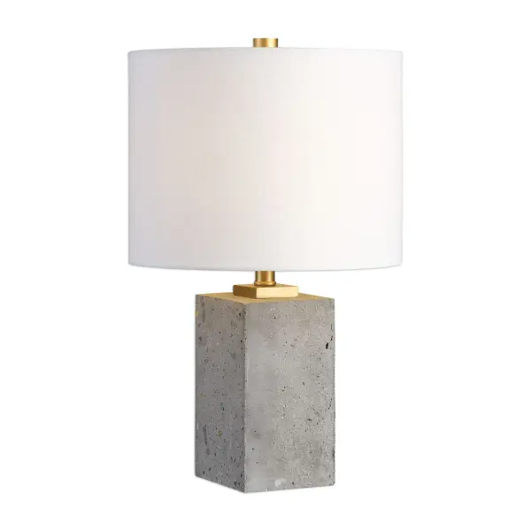 Thick Block Of Porous, Lightly Stained Concrete Accented With Brushed Gold Painted Details. The Round Hardback Drum Shade Is A White Linen Fabric. Collection: Drexel Finish: Brushed Gold Glass: Round Hardback Drum Width: 10.00" Height: 17.00" Length: 10.00" Weight: 9.00 lb Number of Bulbs: 1 Maximum Wattage: 60.00 W Bulb Type: A Voltage: 110.00 V Material: Concrete, Steel Country of Origin: China Safety Rating: Indoor Only Switch: ON-OFF