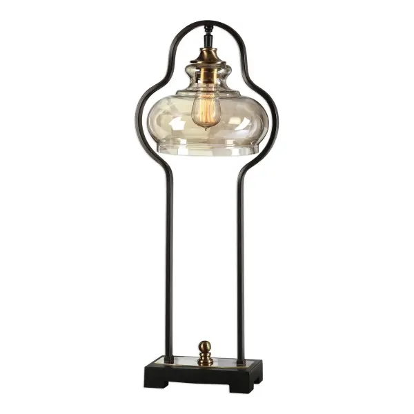 Curvaceous Forged Iron Finished In An Aged Black, Following The Contour Of The Light Amber Glass Shade, Accented With Brushed Antiqued Brass Plated Details. Pictured With An Antique Style Bulb, Not Included. Collection: Cotulla Designer: Matthew Williams Finish: Antique Brass Glass: Glass Shade Width: 11.50" Height: 28.50" Length: 9.25" Weight: 7.75 lb Number of Bulbs: 1 Maximum Wattage: 60.00 W Bulb Type: A Voltage: 110.00 V Material: Metal, Resin And Glass Country of Origin: China Safety Rating: Indoor Only Switch: ON-OFF