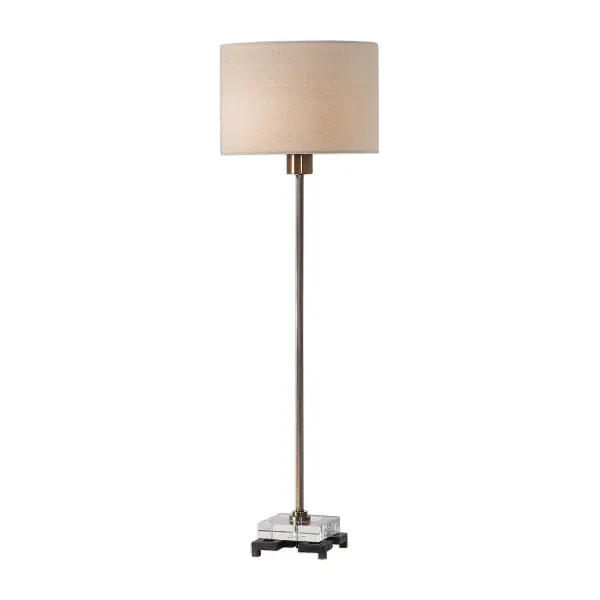 This Simple, Contemporary Buffet Lamp Features Clean Lines And A Versatile Style. The Iron Base Is Finished In A Plated Antique Brass, Displayed On A Thick Crystal Block And A Cast Iron Foot. The Round Hardback Drum Shade Is A Beige Linen Fabric With Light Slubbing. Collection: Danyon Designer: Matthew Williams Finish: Antique Brass Glass: Round Hardback Drum Width: 10.00" Height: 33.00" Length: 10.00" Weight: 5.35 lb Number of Bulbs: 1 Maximum Wattage: 100.00 W Bulb Type: A Voltage: 110.00 V Material: Iron, Crystal, Fabric Country of Origin: Vietnam Safety Rating: Indoor Only Switch: ON-OFF
