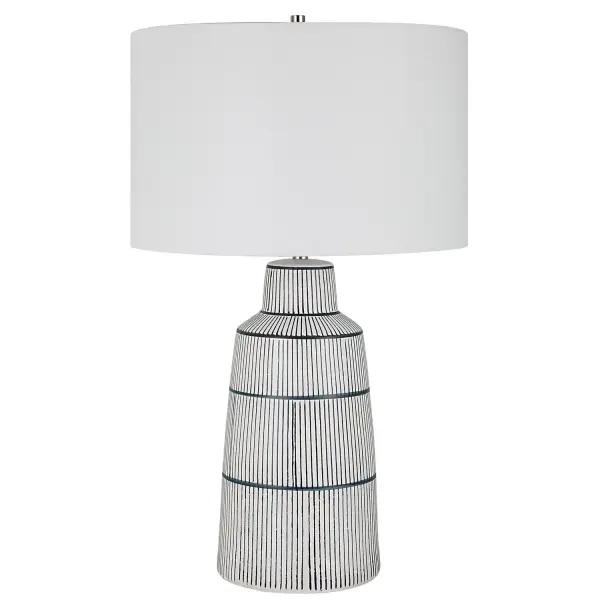 Inspired By The Classic Nautical Stripe Knit, This Ceramic Table Lamp Sports A Satin White Glaze With Rich Navy Blue Stripes And Polished Nickel Plated Accents. The Hardback Drum Shade Is Covered In A Crisp White Linen Fabric. Collection: Breton Designer: Osvaldo Mendoza Finish: Polished Nickel Glass: Round Hardback Drum Width: 17.00" Height: 28.50" Length: 17.00" Weight: 7.00 lb Number of Bulbs: 1 Maximum Wattage: 150.00 W Bulb Type: A Voltage: 110.00 V Material: Steel, Ceramic, Fabric Country of Origin: China Safety Rating: Indoor Only