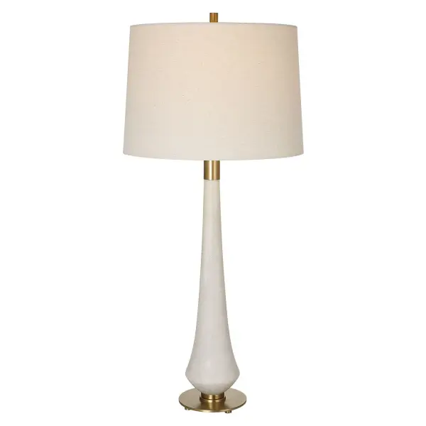 This Table Lamp Adds An Air Of Elegance And Sophistication To Any Space. The Body Of The Lamp Is Crafted From Ivory Man-made Stone That Accurately Replicates The Look Of Thassos Marble And Is Accented By Iron Details Finished In Brushed Brass. The Tapered Hardback Drum Shade Is Covered In A Casual Light Khaki Fabric With Natural Slubbing. Collection: Marille Designer: Carolyn Kinder Finish: Brushed Brass Glass: Tapered Drum Width: 16.00" Height: 35.50" Length: 16.00" Weight: 13.00 lb Number of Bulbs: 1 Maximum Wattage: 150.00 W Bulb Type: A Voltage: 110.00 V Material: Iron, Rice Resin, Linen Country of Origin: China Safety Rating: Indoor Only
