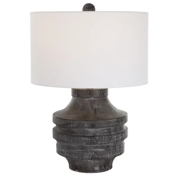 The Timber Table Lamp Offers A Touch Of Rustic Charm With A Carved Wood Look In A Transparent Black Stain With Warm Undertones And A Light White Glaze Accentuating The Faux Wood Grain. The Hardback Drum Shade Is Covered In A White Cotton Fabric. Collection: Timber Designer: Renee Wightman Finish: Black Glass: Round Drum Hardback Width: 17.00" Height: 24.00" Length: 17.00" Weight: 9.70 lb Number of Bulbs: 1 Maximum Wattage: 150.00 W Bulb Type: A Voltage: 110.00 V Material: Resin, Iron, Fabric Country of Origin: China Safety Rating: Indoor Only