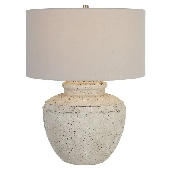 Inspired By Antique Pottery, This Ceramic Table Lamp Features An Aged Stone Finish With Character Distressing And Dark Undertones, Accented With Plated Brushed Nickel Details. The Drum Shade Is Covered In A Light Gray Linen Fabric. Collection: Artifact Designer: Carolyn Kinder Finish: Brushed Nickel Glass: Round Hardback Drum Width: 18.00" Height: 24.50" Length: 18.00" Weight: 19.00 lb Number of Bulbs: 1 Maximum Wattage: 150.00 W Bulb Type: A Voltage: 110.00 V Material: Steel, Ceramic, Fabric Country of Origin: China Safety Rating: Indoor Only