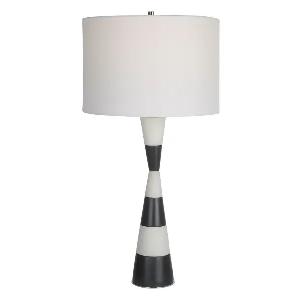 The Bandeau Lamp Is Crafted From A Banded Black And White Man-made Stone That Accentuates Its Hourglass Shape And Accurately Replicates The Look Of Thassos Marble. Iron Details Are Finished In Polished Nickel. Paired With A White Linen Fabric Drum Shade. Collection: Bandeau Finish: Polished Nickel Glass: Round Hardback Drum Width: 14.00" Height: 29.50" Length: 14.00" Weight: 8.00 lb Number of Bulbs: 1 Maximum Wattage: 150.00 W Bulb Type: A Voltage: 110.00 V Material: Rice Stone, Iron, Linen, Resin Country of Origin: China Safety Rating: Indoor Only