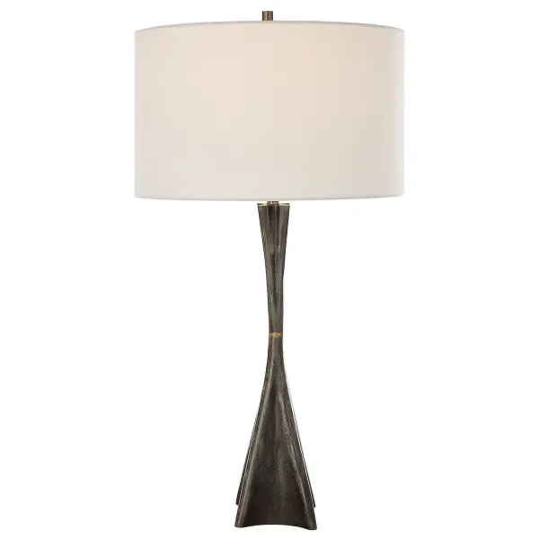 This Cast Iron Lamp Embodies Both Masculine Industrial Style With A Subtle Pitted Texture Accented With Uneven Traces Of Brass Soldering That Enhance The Hand Crafted Construction, And A Feminine Quality With Bold Curves And Delicate Details. The Round Drum Shade Is Wrapped In A White Linen Fabric. Collection: Keiron Designer: Carolyn Kinder Finish: Brass Glass: Round Drum Hardback Shade Width: 17.00" Height: 32.00" Length: 17.00" Weight: 13.00 lb Number of Bulbs: 1 Maximum Wattage: 150.00 W Bulb Type: A Voltage: 110.00 V Material: Steel, Cast Iron, Fabric Country of Origin: China Safety Rating: Indoor Only