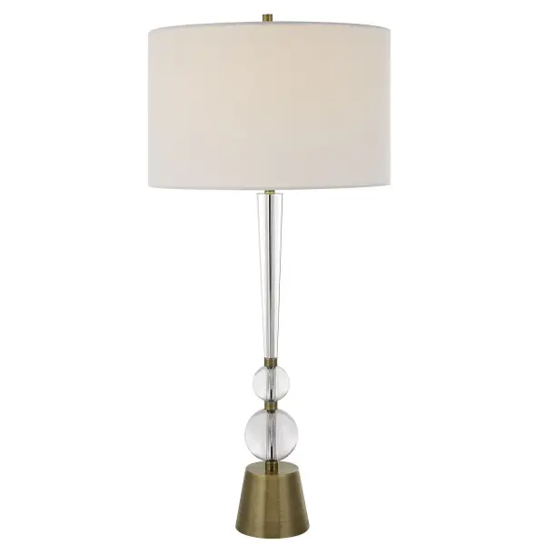 This Elegant Table Lamp Features A Tapered Crystal Column, Paired With Thick Crystal Spheres, Creating A Timeless Design That's Accented With Antiqued Brass Plated Details For An Updated Appeal. The Round Drum Shade Is Covered In A Crisp White Linen Fabric. Collection: Annily Designer: Carolyn Kinder Finish: Antiqued Brass Glass: Round Drum Hardback Shade Width: 17.00" Height: 36.75" Length: 17.00" Weight: 12.00 lb Number of Bulbs: 1 Maximum Wattage: 150.00 W Bulb Type: A Voltage: 110.00 V Material: Steel, Crystal, Fabric Country of Origin: China Safety Rating: Indoor Only