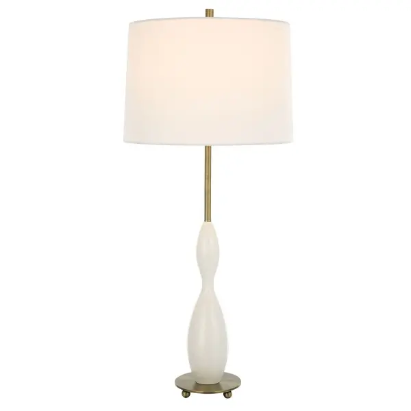 The Soft Silhouette For This Lamp Makes It Versatile In Most Settings By Showcasing A Casted Curvy Base Finished In A Glossy White Paired With Antique Brass Plated Details. The Slightly Tapered Round Shade Is Made From A Crisp White Linen Fabric. Collection: Annora Designer: Carolyn Kinder Finish: Antiqued Brass Glass: Round Hardback Shade Width: 15.00" Height: 34.00" Length: 15.00" Weight: 7.00 lb Number of Bulbs: 1 Maximum Wattage: 150.00 W Bulb Type: A Voltage: 110.00 V Material: Steel, Resin, Fabric Country of Origin: China Safety Rating: Indoor Only