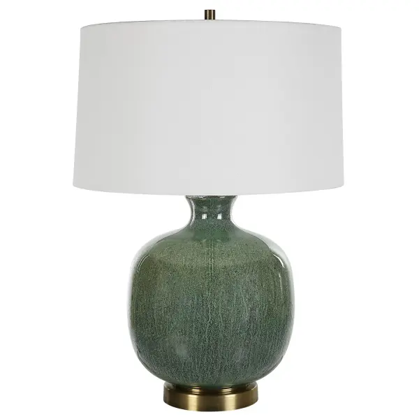 This Unique Glass Lamp Showcases A Gracefully Curved Base Finished In An Aged Green Glaze With Dark Bronze Undertones, Accented With Antique Brass Plated Details. A Slightly Tapered Round Shade Made With A Crisp White Linen Fabric Completes The Piece. Collection: Nataly Designer: Jim Parsons Finish: Antique Brass Glass: Round Hardback Rolled Edge Width: 18.00" Height: 26.00" Length: 18.00" Weight: 7.00 lb Number of Bulbs: 1 Maximum Wattage: 150.00 W Bulb Type: A Voltage: 110.00 V Material: Steel & Glass Country of Origin: China Safety Rating: Indoor Only