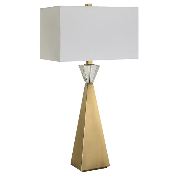 Contemporary In Design Yet Elegant In Style, This Table Lamp Features A Tapered Iron Base Finish In A Plated Antique Brass Topped With A Thick Crystal Ornament. The Rectangle Hardback Shade Is A Crisp White Linen Fabric. Collection: Arete Designer: Carolyn Kinder Finish: Antique Brass Glass: Rectangle Drum Shade Width: 16.00" Height: 31.75" Length: 10.00" Weight: 10.00 lb Number of Bulbs: 1 Maximum Wattage: 150.00 W Bulb Type: A Voltage: 110.00 V Material: Iron, Crystal, Fabric Country of Origin: China Safety Rating: Indoor Only