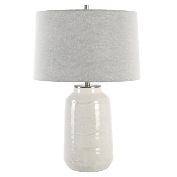 This Farmhouse Inspired Ceramic Table Lamp Features An Off-white Crackle Glaze With Subtle Horizontal Striped Detailing, Paired With Plated Brushed Nickel Accents. A Slightly Tapered Round Hardback Shade In Light Gray Linen Fabric Completes The Piece. Due To The Nature Of Fired Glazes On Ceramic Lamps, Finishes Will Vary Slightly. Collection: Odawa Designer: Osvaldo Mendoza Finish: Brushed Nickel Glass: Round Hardback Shade Width: 17.00" Height: 25.75" Length: 17.00" Weight: 12.00 lb Number of Bulbs: 1 Maximum Wattage: 150.00 W Bulb Type: A Voltage: 110.00 V Material: Steel, Ceramic, Fabric Country of Origin: China Safety Rating: Indoor Only