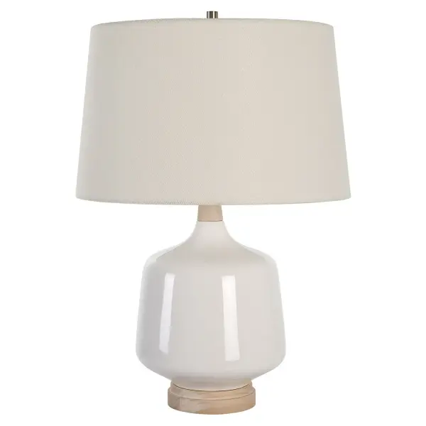 This Ceramic Table Lamp Featuring A White High Gloss Glaze Accented By Brushed Nickel Finishes. The Natural Wood Base And Neck Adds Organic Elements To This Versatile Design. A Slightly Tapered Off-white Linen Hardback Shade Completes The Piece. Collection: Opal Designer: Osvaldo Mendoza Finish: Brushed Nickel Glass: Round Hardback Shade Width: 17.00" Height: 24.50" Length: 17.00" Weight: 7.00 lb Number of Bulbs: 1 Maximum Wattage: 150.00 W Bulb Type: A Voltage: 110.00 V Material: Wood, Ceramic, Fabric Country of Origin: China Safety Rating: Indoor Only
