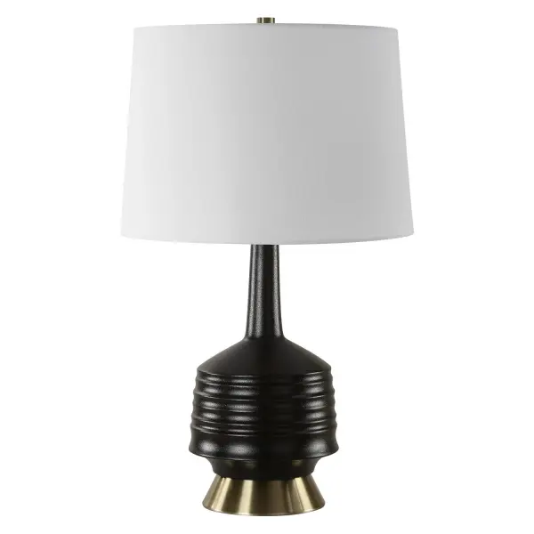 This Table Lamp Features A Ribbed Ceramic Base Adorned In A Lightly Textured Black Glaze, Displayed On A Plated Antique Brass Tapered Foot. The Tapered Round Hardback Shade Is Covered In A Crisp White Linen Fabric. Collection: Foster Designer: David Frisch Finish: Antique Brass Glass: Round Hardback Shade Width: 16.00" Height: 26.00" Length: 16.00" Weight: 7.30 lb Number of Bulbs: 1 Maximum Wattage: 150.00 W Bulb Type: A Voltage: 110.00 V Material: Ceramic, Metal, Fabric Country of Origin: China Safety Rating: Indoor Only