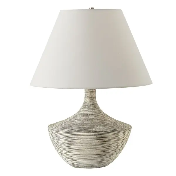 Where Vintage Charm Meets Contemporary Design, The Carafe Table Lamp Features A Charcoal Ceramic Base With Stone Ivory Ribbed Overlay And Heavy Distressing. Enhanced With Brushed Nickel Plated Details, This Lamp Adds A Touch Of Modern Refinement To Any Space. The Round Hardback Shade Is Covered In A Off-white Linen Fabric. Collection: Carafe Designer: Osvaldo Mendoza Finish: Brushed Nickel Glass: Round Hardback Shade Width: 16.00" Height: 20.50" Length: 16.00" Weight: 6.00 lb Number of Bulbs: 1 Maximum Wattage: 150.00 W Bulb Type: A Voltage: 110.00 V Material: Steel, Ceramic, Fabric Country of Origin: China Safety Rating: Indoor Only