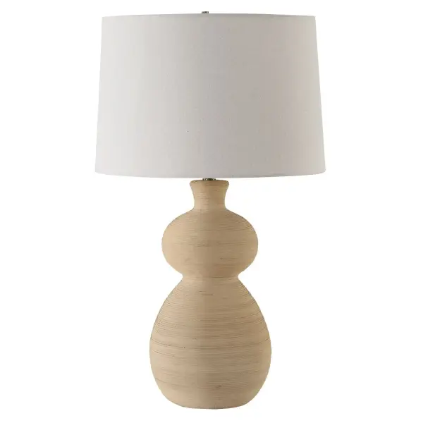 The Pueblo Table Lamp Combines The Rustic Beauty Of The Southwest With A Touch Of Timeless Elegance And Classic Silhouette. Crafted With A Heavily Textured Ceramic Base In A Warm Organic Clay Finish And Enhanced With Plated Brushed Antique Brass Details. The Slightly Tapered Round Drum Hardback Shade Is A Light Beige Linen Fabric. Collection: Pueblo Designer: Osvaldo Mendoza Finish: Brushed Antique Brass Glass: Round Hardback Shade Width: 17.00" Height: 28.00" Length: 17.00" Weight: 8.00 lb Number of Bulbs: 1 Maximum Wattage: 150.00 W Bulb Type: A Voltage: 110.00 V Material: Ceramic, Metal, Fabric Country of Origin: Cambodia Safety Rating: Indoor Only