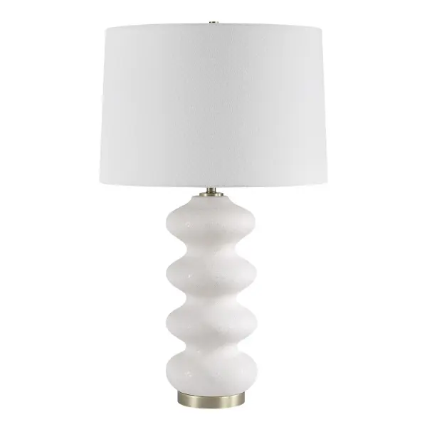 This Porcelain Lamp Exudes An Elegant Quality With Its Graceful Flowing Design And White Tone-on-tone Glaze. Its Subtle Texture Adds Depth And Character, While Brushed Antique Plated Brass Accents Bring A Touch Of Warmth And Sophistication. Finished With A Slightly Tapered Round Hardback Shade Covered In A White Linen Fabric. Collection: Liora Designer: David Frisch Finish: Brushed Antique Brass Glass: Round Hardback Shade Width: 16.00" Height: 26.25" Length: 16.00" Weight: 5.30 lb Number of Bulbs: 1 Maximum Wattage: 150.00 W Bulb Type: A Voltage: 110.00 V Material: Porcelain & Fabric & Steel Country of Origin: China Safety Rating: Indoor Only