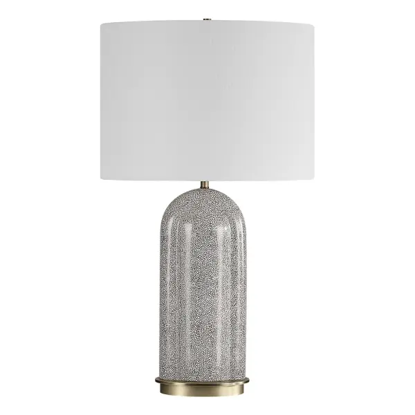This Eye-catching Lamp Features A Porcelain Base Adorned With A Unique White Dapple Pattern, Set Against A Rich Dark Chocolate Background. Brushed Antique Brass Plated Accents Add The Perfect Touch Of Warmth And Sophistication To This Piece. The Oval Hardback Shade Is Finished In A White Linen Fabric. Collection: Dapple Designer: David Frisch Finish: Brushed Antique Brass Glass: Oval Hardback Shade Width: 17.00" Height: 29.50" Length: 11.00" Weight: 11.00 lb Number of Bulbs: 1 Maximum Wattage: 150.00 W Bulb Type: A Voltage: 110.00 V Material: Porcelain & Fabric & Steel Country of Origin: China Safety Rating: Indoor Only