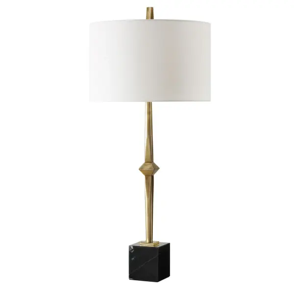 The Suranne Table Lamp Features A Slender Metal Column In A Sophisticated Plated Antique Brass Finish, Standing Proudly On A Robust Block Of Black Marble With Subtle Veining. The Round Hardback Drum Shade Is A Finished In A Crisp White Linen. Collection: Suranne Designer: Osvaldo Mendoza Finish: Antique Brass Glass: Round Drum Hardback Shade Width: 16.00" Height: 35.25" Length: 16.00" Weight: 11.00 lb Number of Bulbs: 1 Maximum Wattage: 150.00 W Bulb Type: A Voltage: 110.00 V Material: Metal, Marble, Fabric Country of Origin: China Safety Rating: Indoor Only