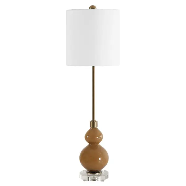 Where Elegance Meets Modern Sophistication, The Sienna Buffet Lamp Features A Caramel Brown, Seeded Glass Base. The Design Is Elevated With A Thick Crystal Foot And Accents Of Plated Brushed Antique Brass Hardware, Adding A Touch Of Refined Luxury To Any Setting. The Round Drum Hardback Shade Is Covered In A White Linen Fabric. Collection: Sienna Designer: Carolyn Kinder Finish: Brushed Antique Brass Glass: Round Drum Hardback Shade Width: 11.00" Height: 36.00" Length: 11.00" Weight: 8.00 lb Number of Bulbs: 1 Maximum Wattage: 150.00 W Bulb Type: A Voltage: 110.00 V Material: Iron, Crystal, Fabric, Glass Country of Origin: China Safety Rating: Indoor Only