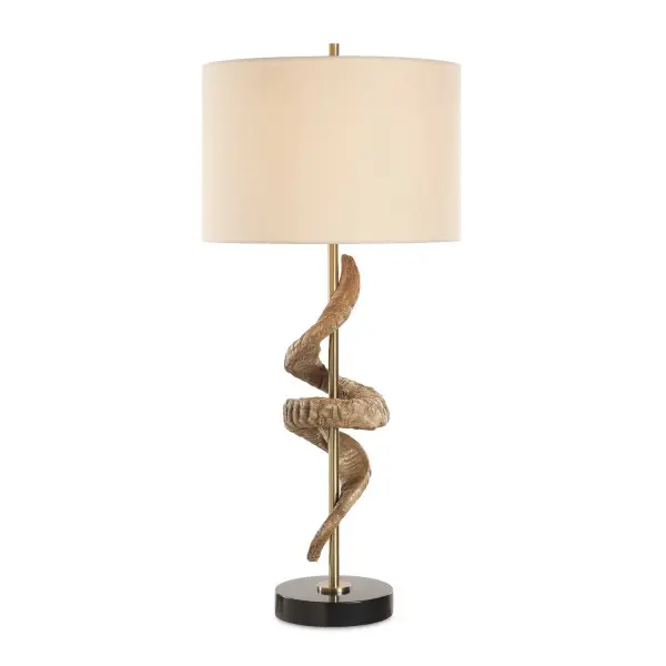 This Eye-catching Table Lamp Showcases A Sculpture Inspired By A Rams Horn Displayed Around A Plated Antique Brass Column And A Thick Black Marble Foot. A Round Hardback Drum Shade Made With An Off-white Linen Fabric Completes The Piece. Collection: Rams Designer: Osvaldo Mendoza Finish: Antique Brass Glass: Round Drum Hardback Shade Width: 15.00" Height: 33.50" Length: 15.00" Weight: 12.00 lb Number of Bulbs: 1 Maximum Wattage: 150.00 W Bulb Type: A Voltage: 110.00 V Material: Steel, Marble, Fabric, Resin Country of Origin: China Safety Rating: Indoor Only