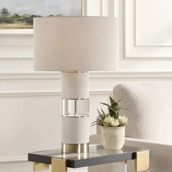 The Maliyah Table Lamp Features A Casual, Light Beige Linen Wrapped Base Paired With An Elegant Crystal Detail. The Soft Texture, Neutral Tone And The Sparkle Of Clear Crystal Create Timeless Sophistication. A Round Hardback Shade Made With Matching Light Beige Linen Fabric Completes The Piece. Collection: Maliyah Designer: Renee Wightman Finish: Light Beige Linen Wrapped Glass: Round Hardback Shade Width: 18.00" Height: 29.00" Length: 18.00" Weight: 14.30 lb Number of Bulbs: 1 Maximum Wattage: 150.00 W Bulb Type: A Voltage: 110.00 V Material: Metal, Crystal, Fabric Country of Origin: Cambodia Safety Rating: Indoor Only