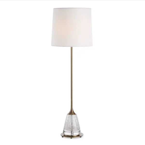 The Alistair Buffet Lamp Features A Heavily Seeded Glass Base Paired With Plated Antique Brass Details That Bring Elegance To Any Space. The Slightly Tapered Hardback Shade Is Covered In White Linen Fabric That Complements The Piece. Collection: Alistair Designer: Osvaldo Mendoza Finish: Antique Brass Glass: Round Hardback Shade Width: 11.00" Height: 34.25" Length: 11.00" Weight: 6.00 lb Number of Bulbs: 1 Maximum Wattage: 150.00 W Bulb Type: A Voltage: 110.00 V Material: Metal, Glass, Fabric Country of Origin: China Safety Rating: Indoor Only