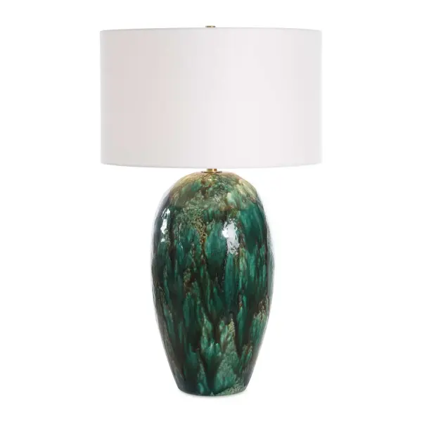 The Ceraline Table Lamp Features A Deep Emerald Green Drip Glaze With Subtle Rust Brown Undertones Paired With Brushed Brass-plated Details. The Round Hardback Drum Shade Is Covered In A Casual White Linen Fabric. Due To The Nature Of Fired Glazes On Ceramic Lamps, Finishes Will Vary Slightly. Collection: Ceralene Designer: Carolyn Kinder Finish: Brushed Brass Glass: Round Drum Hardback Shade Width: 20.00" Height: 33.25" Length: 20.00" Weight: 16.00 lb Number of Bulbs: 1 Maximum Wattage: 150.00 W Bulb Type: A Voltage: 110.00 V Material: Ceramic, Iron, Fabric Country of Origin: China Safety Rating: Indoor Only