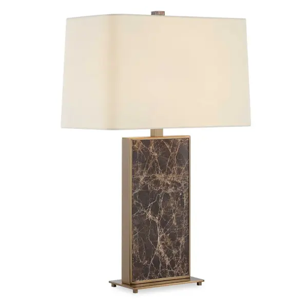 The Lafferty Table Lamp Showcases A Emperador Dark Brown Marble Slab Encased In A Plated Brass Frame, Accented With Matching Details. The Slightly Tapered Rectangular Hardback Shade Is An Off-white Linen Fabric With Soft Curved Corners. Collection: Lafferty Designer: Carolyn Kinder Finish: Brass Glass: Rectangle Hardback Shade Width: 18.00" Height: 28.25" Length: 18.00" Weight: 21.00 lb Number of Bulbs: 1 Maximum Wattage: 150.00 W Bulb Type: A Voltage: 110.00 V Material: Marble, Metal, Fabric Country of Origin: China Safety Rating: Indoor Only