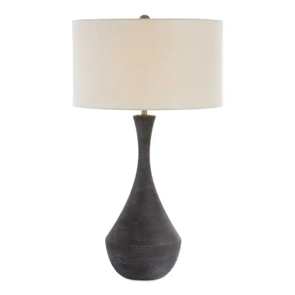 This Ceramic Table Lamp Features A Heavy Horizontal Texture Finished In A Rustic Dark Charcoal Glaze, Accented With Plated Brass Details. A Round Hardback Drum Shade Finished In A Casual Off-white Linen Fabric Completes The Piece. Collection: Helston Designer: Carolyn Kinder Finish: Brass Glass: Round Drum Hardback Shade Width: 19.00" Height: 34.00" Length: 19.00" Weight: 9.00 lb Number of Bulbs: 1 Maximum Wattage: 150.00 W Bulb Type: A Voltage: 110.00 V Material: Metal, Ceramic, Fabric Country of Origin: China Safety Rating: Indoor Only