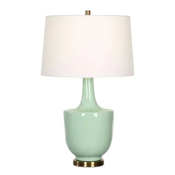 The Kyla Table Lamp Showcases Modern Elegance With Its Sleek Mint Green Ceramic Base Complemented By Antique Brass Plated Details. The Tapered Round Hardback Shade Is Covered In A Crisp White Linen Fabric. Collection: Kyla Designer: David Frisch Finish: Antique Brass Glass: Round Hardback Shade Width: 18.00" Height: 30.00" Length: 18.00" Weight: 10.00 lb Number of Bulbs: 1 Maximum Wattage: 150.00 W Bulb Type: A Voltage: 110.00 V Material: Ceramic, Metal, Fabric Country of Origin: Cambodia Safety Rating: Indoor Only